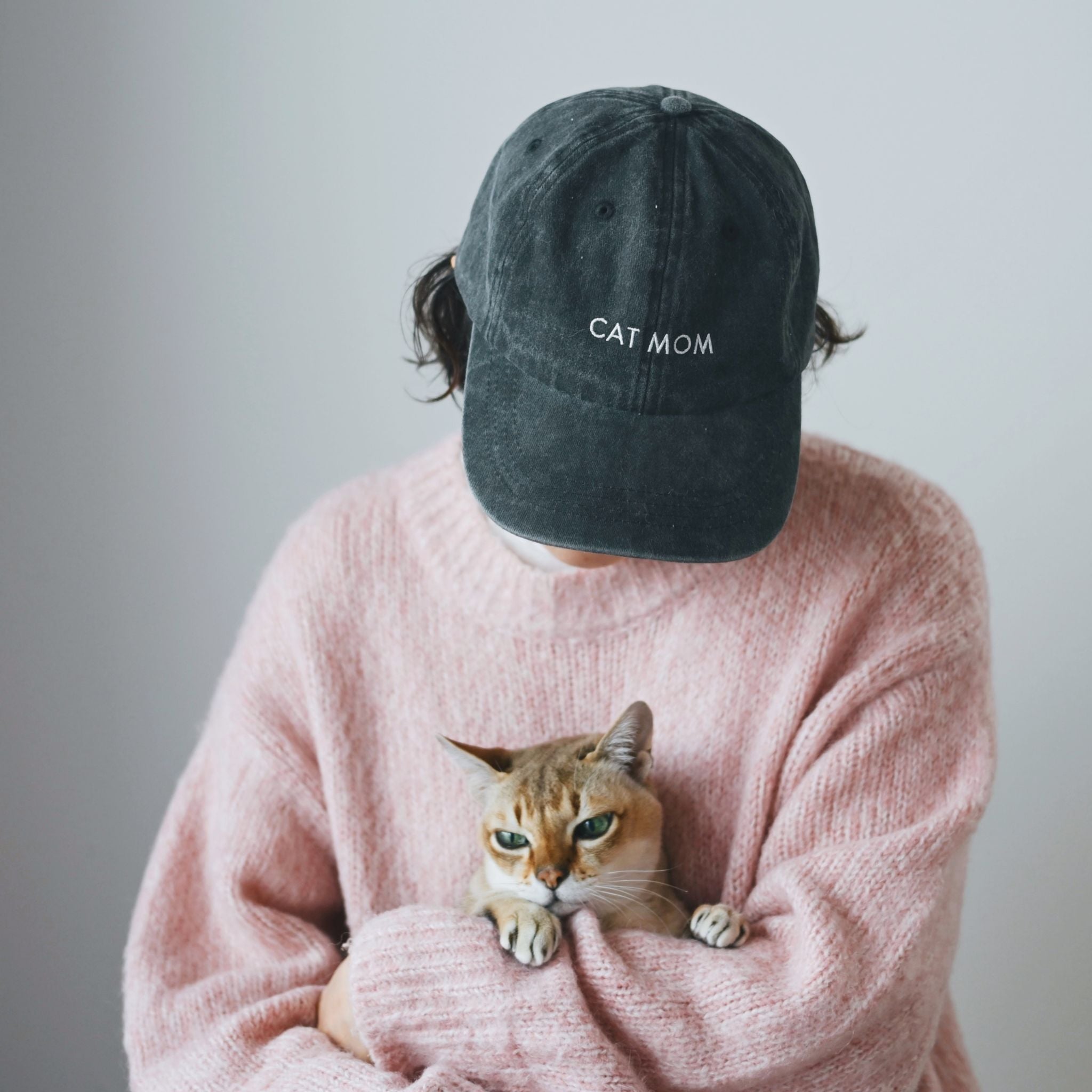 black-denim-cap-cat-mom-woman-wearing.jpg